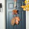 Glitzhome® 24.5" Fall Wood Maple Leaves with Bowknot Door Hanger